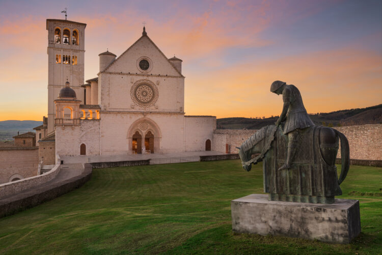 Assisi, Italy with the Basilica of Saint Francis of Assisi at dusk.
