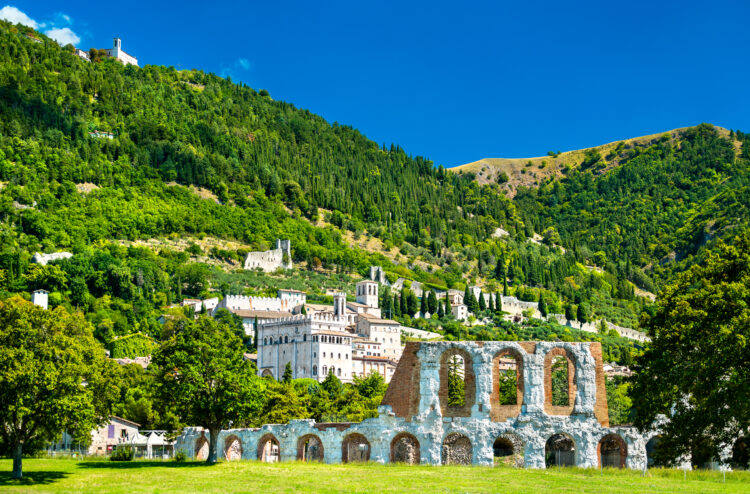 View of Gubbio with roman theatre and medieval towers in Umbria, Italy