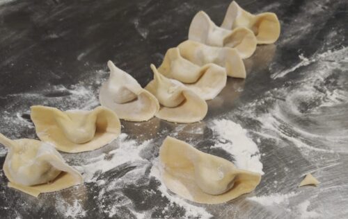 Half-moon shaped ravioli of casoncelli