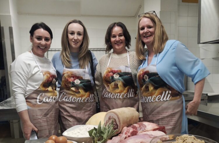 Emma with travel professionals at the pasta making workshop