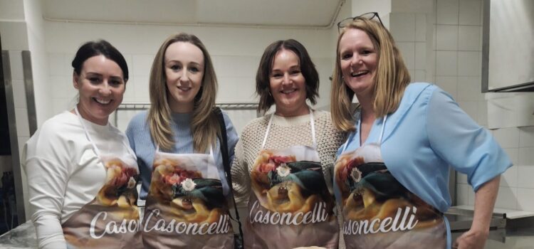 Emma with travel professionals at the pasta making workshop