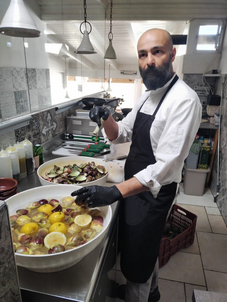 Local trattoria chef prepping for dinner in Puglia