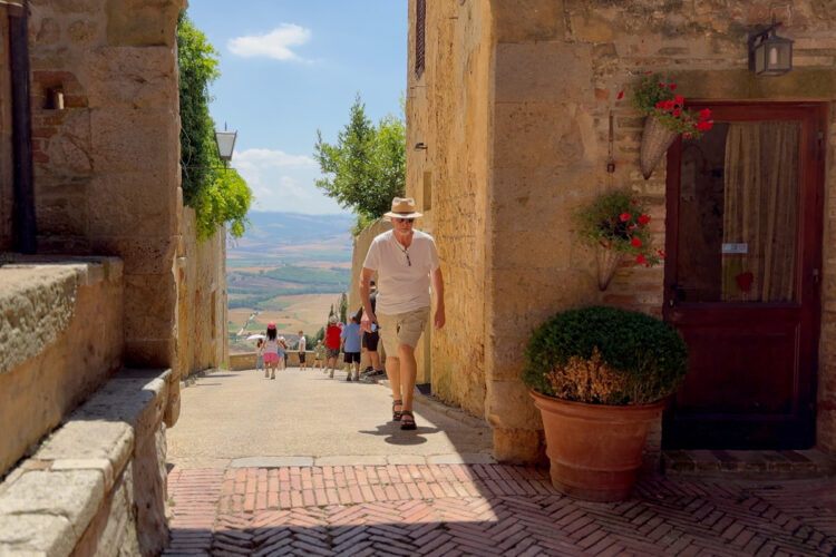 A man walking in Pienza, Italy